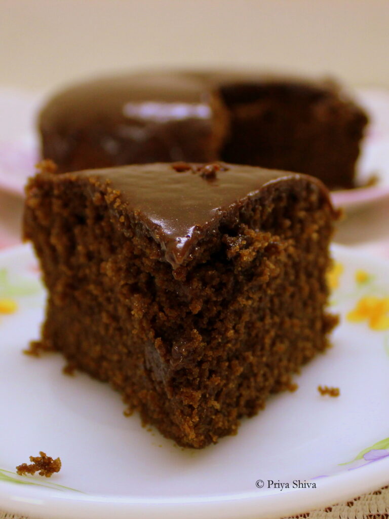 Eggless chocolate coffee cake topped with chocolate ganache 